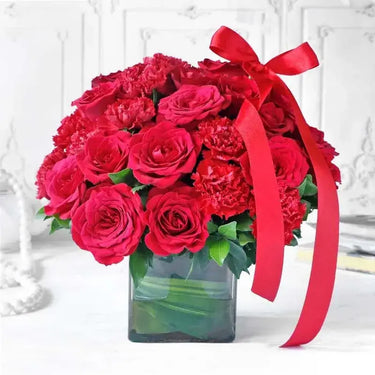 Red Roses & Carnations, Stunning Arrangement, Red Roses, Red Carnations, Green Leaves, Square Glass Vase, Ribbon Bow
